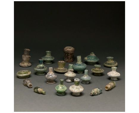 C. 100-1400 AD. Roman, Sasanian and Islamic. A collection of 20 small glass vessels, reconstructed from fragments, of various