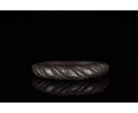 c. 900-1100 AD. Viking Age. Twisted silver ring comprising of circular hoop comprised of interwoven strands of silver which w