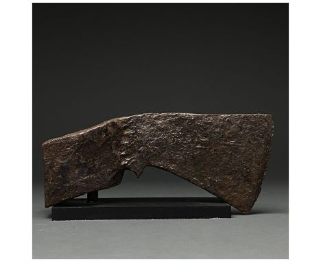 c. 900-1100 AD. Viking age. An iron axe head comprising a short blade, elongated, downward-angled check and poll with a round