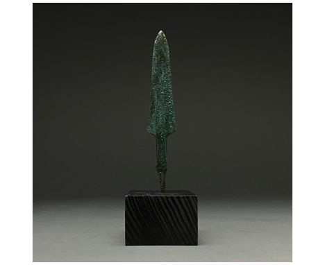 1200-700 BC, Greek Archaic Period. A bronze spearhead with a flaring triangular, lentoid-sectioned blade with a wide raised m