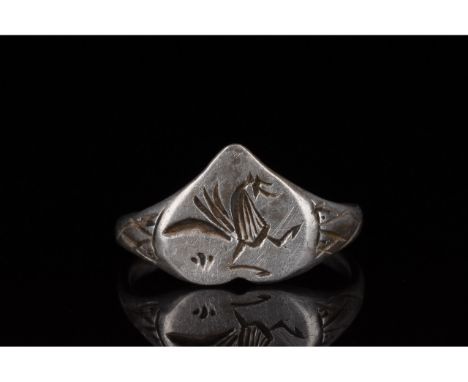 700-1100 AD, Viking Age. Beautiful silver ring comprised of a D-shaped hoop, flaring shoulders with incised decoration and an