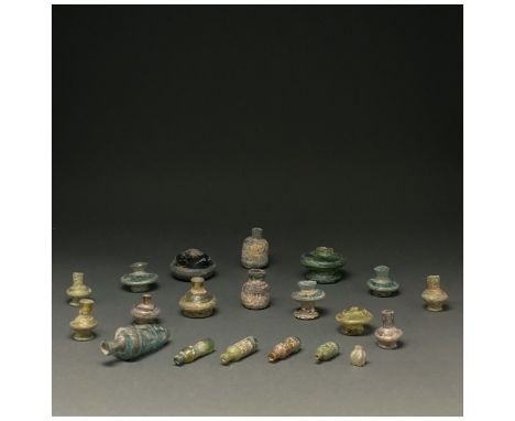 C. 100-1400 AD. Roman, Sasanian and Islamic. A collection of 20 small glass vessels, reconstructed from fragments, of various