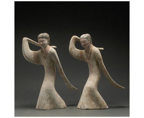 C. 202 BC to 220 AD. Han Dynasty. A pair of delicate Han Dynasty dancers with long sleeves. Both dancers are wearing a long f