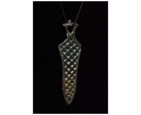 Ca. 700-1100 AD. Viking Age. A bronze pendant in the shape of sword comprising an openwork triangular pommel, short handle lo