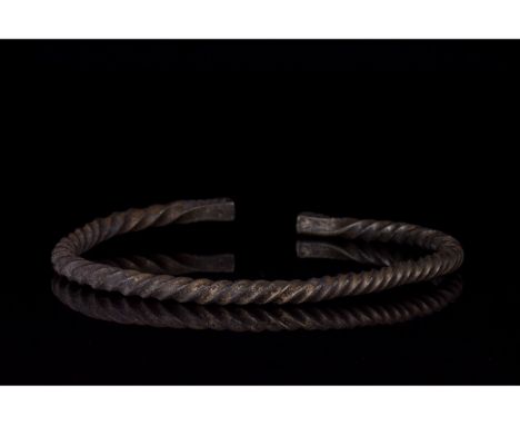 700-1100 AD, Viking Age. A silver twisted bracelet comprising a single strand of twisted silver with flattened terminals deco