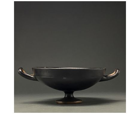 c. 300 BC. South Italian. A terracotta kylix with hemispherical bowl, ring foot and two equally spaced loop handles; stamped 
