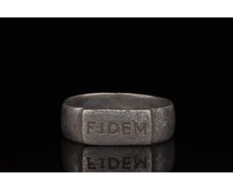 100-300 AD. Roman. A silver ring with a D-shaped hoop and raised, rectangular bezel bearing the inscription â€œFIDEM.â€ (â€œL