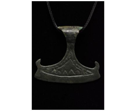 700-1100 AD, Viking Age. A large bronze example of an axe or Perun amulet comprising a suspension loop and a stylised axe hea