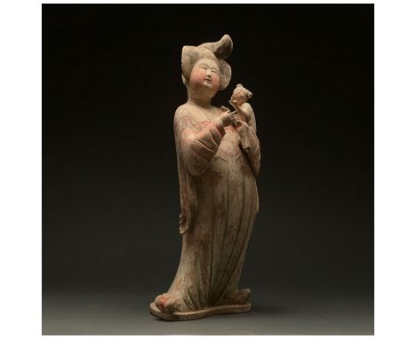 Ca. 618-907 AD. Chinese Tang Dynasty Ceramic â€˜Fat Ladyâ€™ Figure. The figure stands facing forward, with one foot angled to