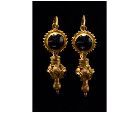 100-300 AD. Roman period. An elaborate pair of gold earrings each comprising (from top to bottom): a faux woven hoops from wh