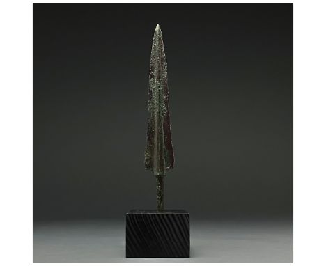 1200-700 BC, Greek Archaic Period. A squat bronze spearhead with a flaring leaf-shaped, lentoid-sectioned blade, raised midri
