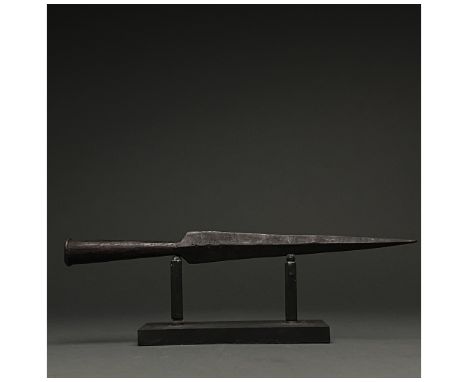C. 100â€“300 AD. A socketed iron spearhead comprising a triangulat blade with raised midrib. Spearhead of this type were a ke