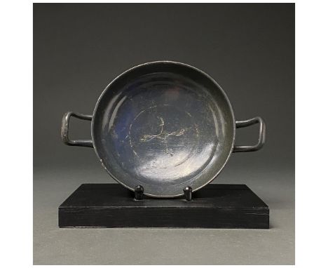 c. 300 BC. South Italian. A terracotta kylix with hemispherical bowl, ring foot and two equally spaced loop handles; stamped 