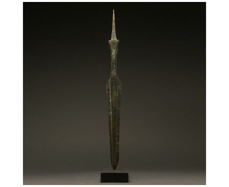 1200-700 BC, Greek Archaic Period. Bronze Age. A bronze spearhead with a leaf-shaped, lentoid sectioned blade, a wide raised 