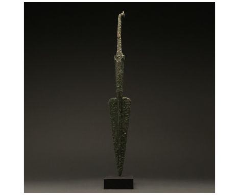 1200-700 BC, Greek Archaic Period. Bronze Age. A bronze spearhead with a leaf-shaped, lentoid sectioned blade, a wide raised 