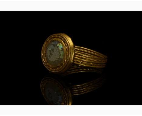 CA. 600 AD; GOLD BYZANTINE RING WITH GLASS COBOCHON. In order to confirm its authenticity, this piece has undergone X-Ray Flu