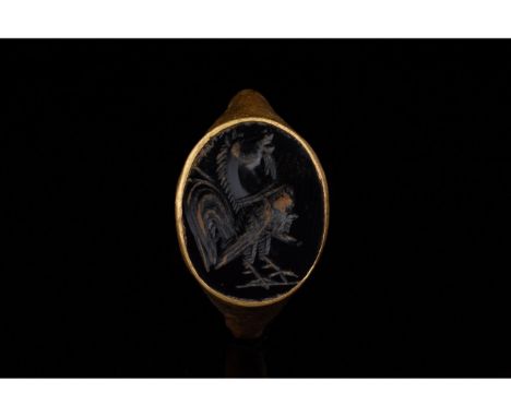 C. 100-300 AD. Roman. Gold ring comprising D-shaped hoop with broad shoulders decorated with incised gemoetric motifs and a r