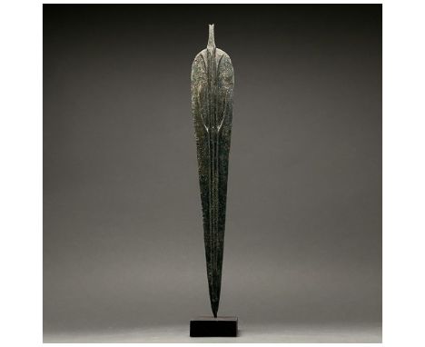 1200-700 BC, Greek Archaic Period. This beautiful cast bronze sword has a tapering, bevelled blade adornned with a deep fulle