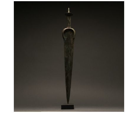 1200-700 BC, Greek Archaic Period. This beautiful cast bronze sword has a tapering, bevelled blade, with a raised central mid