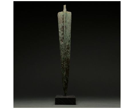 1200-700 BC, Greek Archaic Period. This beautiful cast bronze sword has a tapering, bevelled blade with a raised midrib and a
