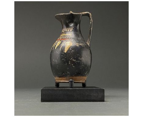 400-300 BC. Southern Italian. Gnathian oinochoe with trilobate spout, constricted neck, piriform body, ring base and L-shaped