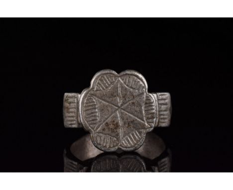 1000-1500 AD, Crusader Period. Silver ring with circular hoop, highly decorated, stepped shoulders, and flattened, rosette sh