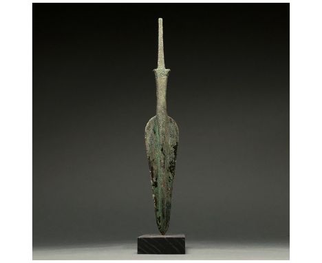 1200-700 BC, Greek Archaic Period. A bronze spearhead with a triangular, lentoid-sectioned blad with a raised midrib, short n