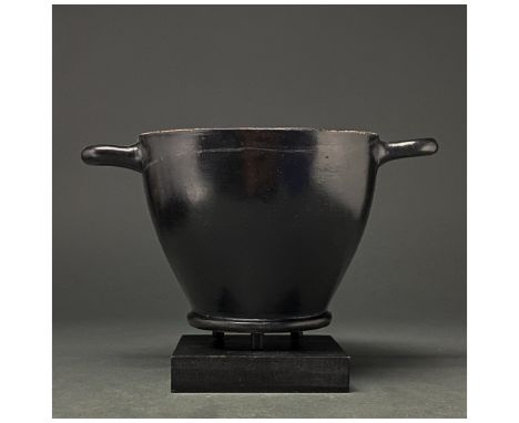 c. 300 BC. Greek Attic. Terracotta skypos, with deep, curved sides, ring foot and two equally spaced loop handles. The whole 