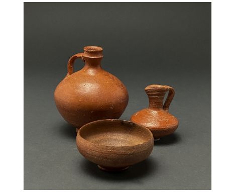 C. 300-400 AD. Late Roman. A lot of three terra sigillata vessils including one ring-footed bowl, one globular ring-footed ju