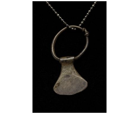 700-1100 AD, Viking Age. A silver example of an axe or Perun amulet comprising a large suspension loop and a stylised axe hea