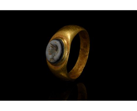 CA. 100 AD. ROMAN GOLD INTAGLIO RING WITH NICOLO PORTRAIT STONE. In order to confirm its authenticity, this piece has undergo