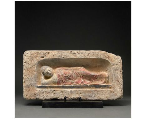 Ca.960-1279 AD. Chinese Song Dynasty. A rectangular, terracotta-coloured brick with a reclining musician within a recess; the