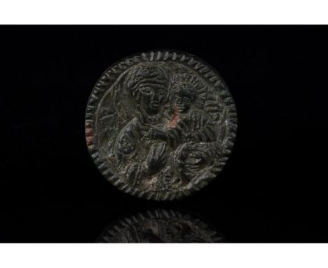 C. 1000-1500 AD. Crusaders period. A bronze, disk-shaped medallion with scalloped edges depicting the Virgin Mary holding an 