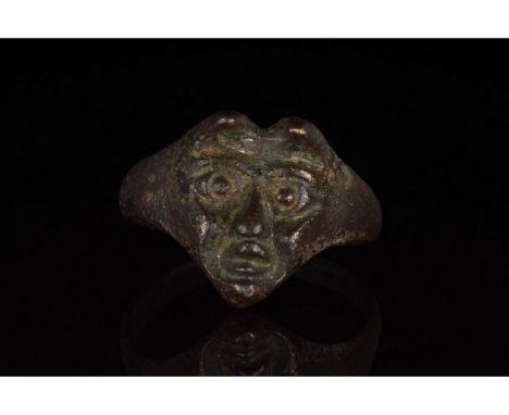 C. 1500-1700 AD. Post-medieval. A rare silver ring with a circular hoop and applied bezel in the form of a devilâ€™s head, wi