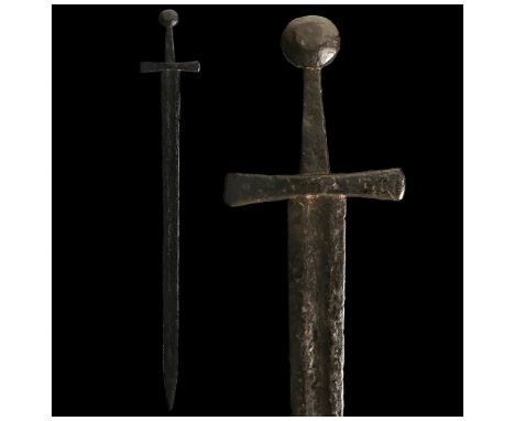 700-1000 AD. Viking age. An iron sword with a long, doubled-edged blade, culminating in a point and a wide, broad, tapering g