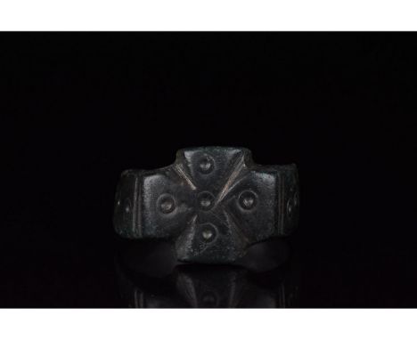 1000-1500 AD, Crusader Period. A heavy bronze ring with a D-shaped hoop and Maltese cross bezel; both the shoulders and the c