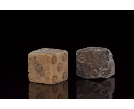 100-200 AD. Roman. A set of two bone dice with carefully carved dot-in-circle pips which are typical of dice of the Roman per