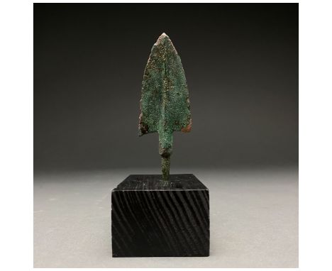 1200-700 BC, Greek Archaic Period. A bronze spearhead with a triangular, lentoid-sectioned blade with a raised midrib, short 