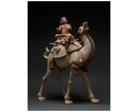 C. AD 618-907. Tang Dynasty. A large ceramic figurine of a Bactrian camel, also known as a Mongolian camel, with a rider. The