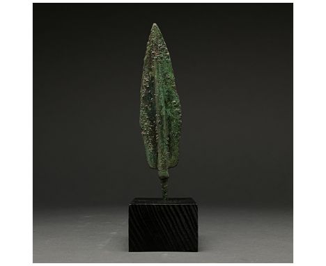 1200-700 BC, Greek Archaic Period. A bronze spearhead with a lozenge shaped, lentoid-sectioned blade with a raised midrib, sh