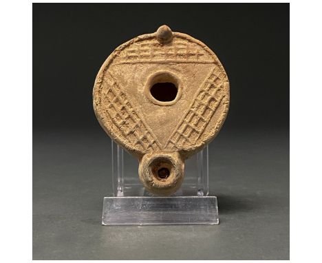 100-300 AD. Roman. A beautiful terracotta oil lamp decorated linear motifs. The oldest Roman lamps date to the third century 
