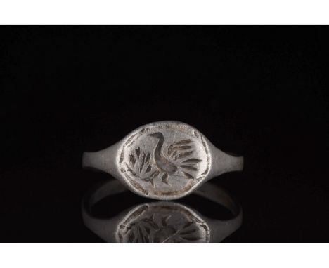 700-1100 AD, Viking Age. Beautiful silver ring comprised of a D-shaped hoop and a circular bezel bearing incised decoration i