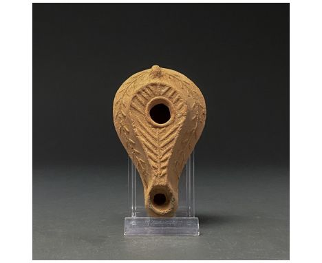 100-300 AD. Roman. A beautiful terracotta oil lamp decorated with floral and linear motifs. The oldest Roman lamps date to th