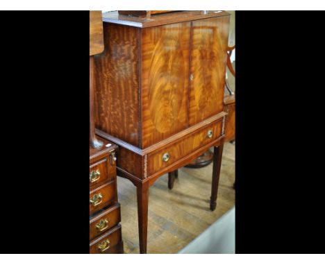 A cocktail cabinet, 72 cm wide, two sideboards, a cake stand, a reproduction dwarf longcase clock, three mirrors, an armchair