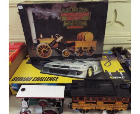 A Hornby Stephensons Rocket Real Steam Train set, 3½ inch gauge model, an associated carriage, a Mamod Steam Tractor, and a S