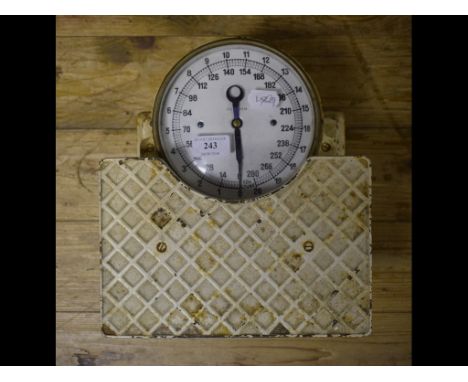 A set of cast iron bathroom scales, with enamel register
