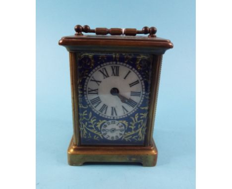 A carriage clock, with porcelain panels, in a four pillar case, 13.5 cm high (over handle)