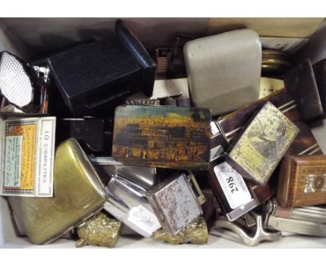 A lacquered snuff box, decorated The Great Exhibition 1851, other snuff boxes, lighters, cigarette cases and items