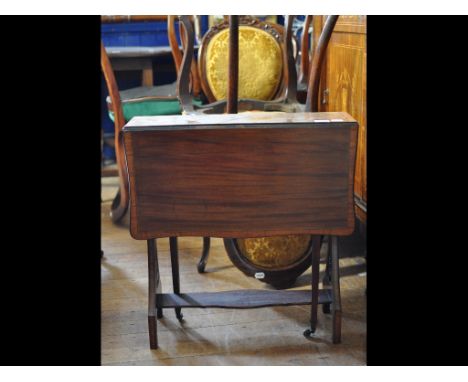 An Edwardian inlaid mahogany Sutherland table, a pair of Victorian carved walnut dining chairs, a set of four dining chairs, 