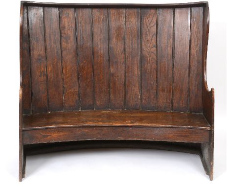 A 19th century elm curved settle, 154 cm wide  See illustration Condition report Report by RB

Generally pretty good and mark